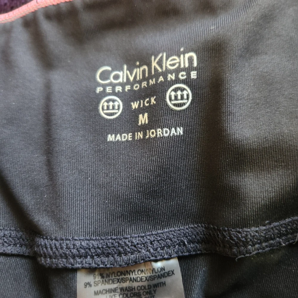 Calvin Klein 20" Cropped Black Leggings with Iridescent "CALVIN" Logo - Picture 3 of 8